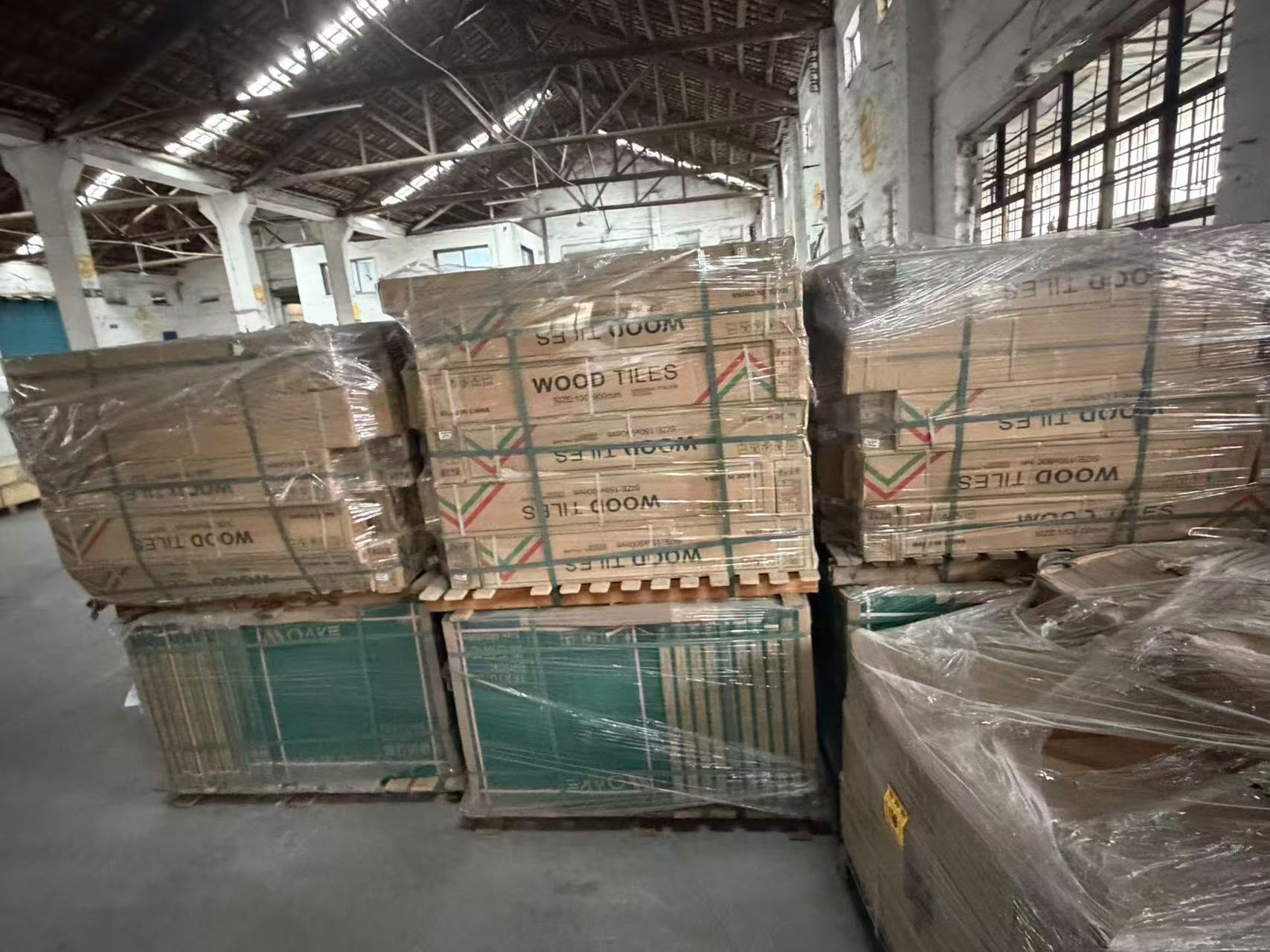 Pallets of tiles wrapped and staged in Guangzhou warehouse