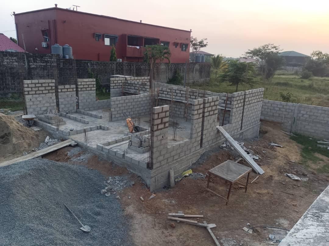 Duplex 3 — exterior view at sunset, foundations and walls