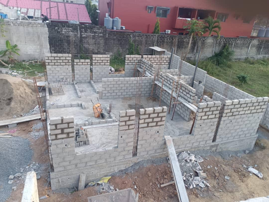 Duplex 3 — block walls rising, interior view of construction site